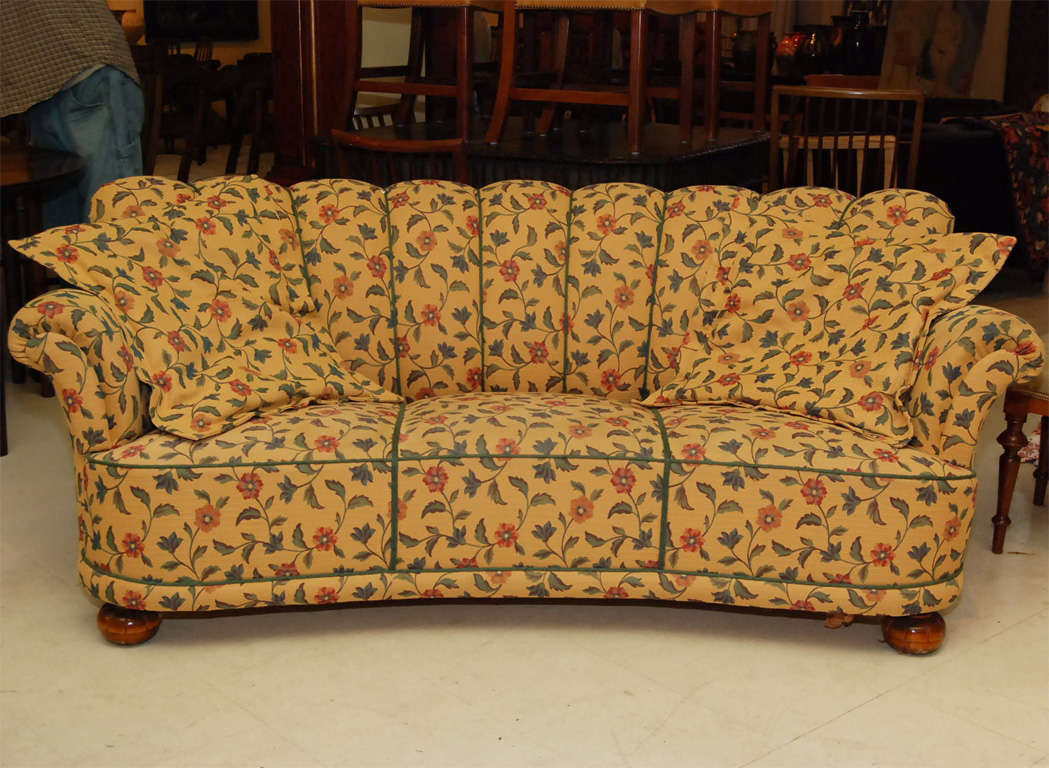 Swedish sofa, floral fabric in pale yellow background, channelled upholstery and bun feet, including two pillows