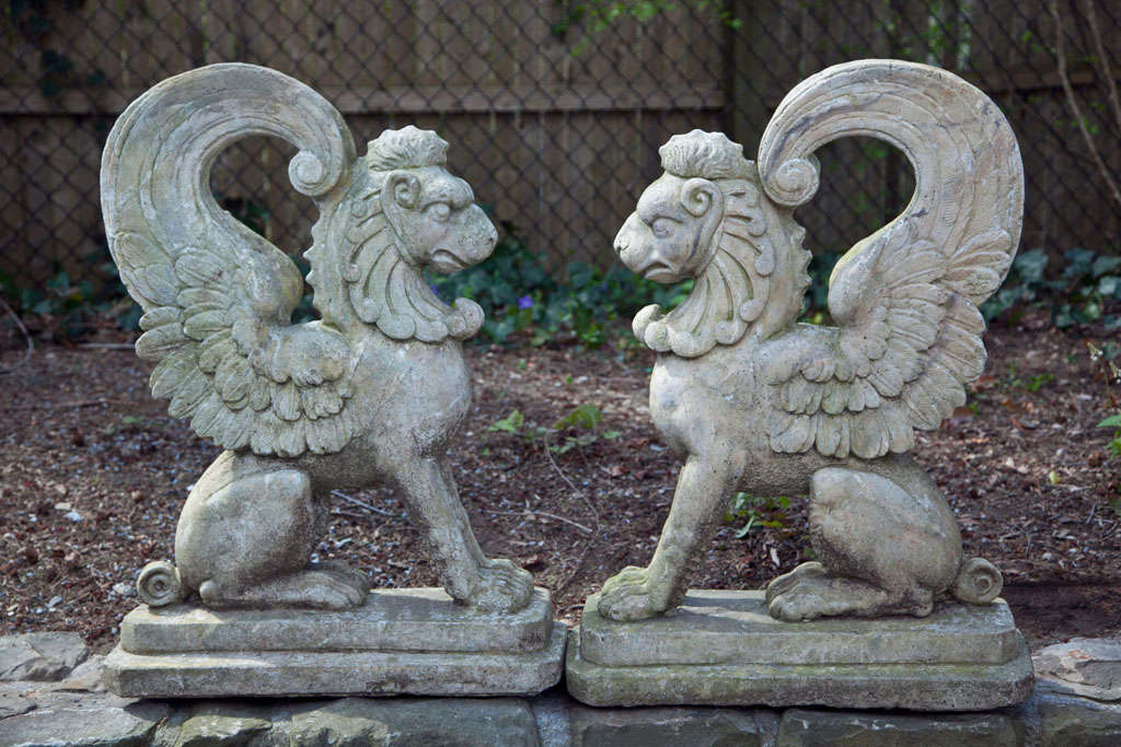In mythology griffins are known for guarding treasure and priceless possessions. This pair of seated griffins on plinths is highly detailed.