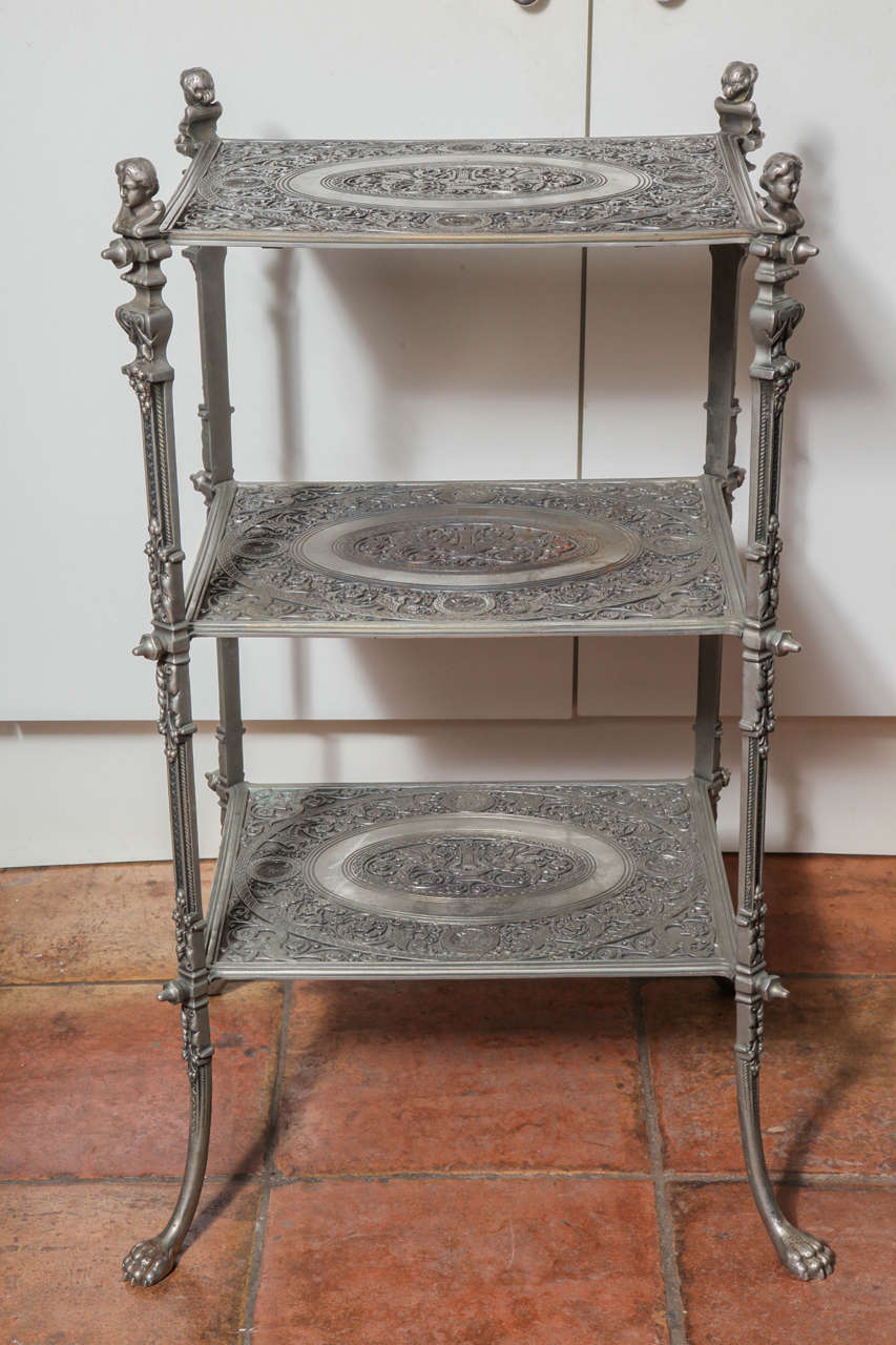 This gorgeous Mägdesprunger Regency antique obelisk table is from 19th century, Germany. It is a unique cast iron table.
The long and straight legs include a shape of a woman's bust at the top and feet at the bottom.
The rigid geometric design is