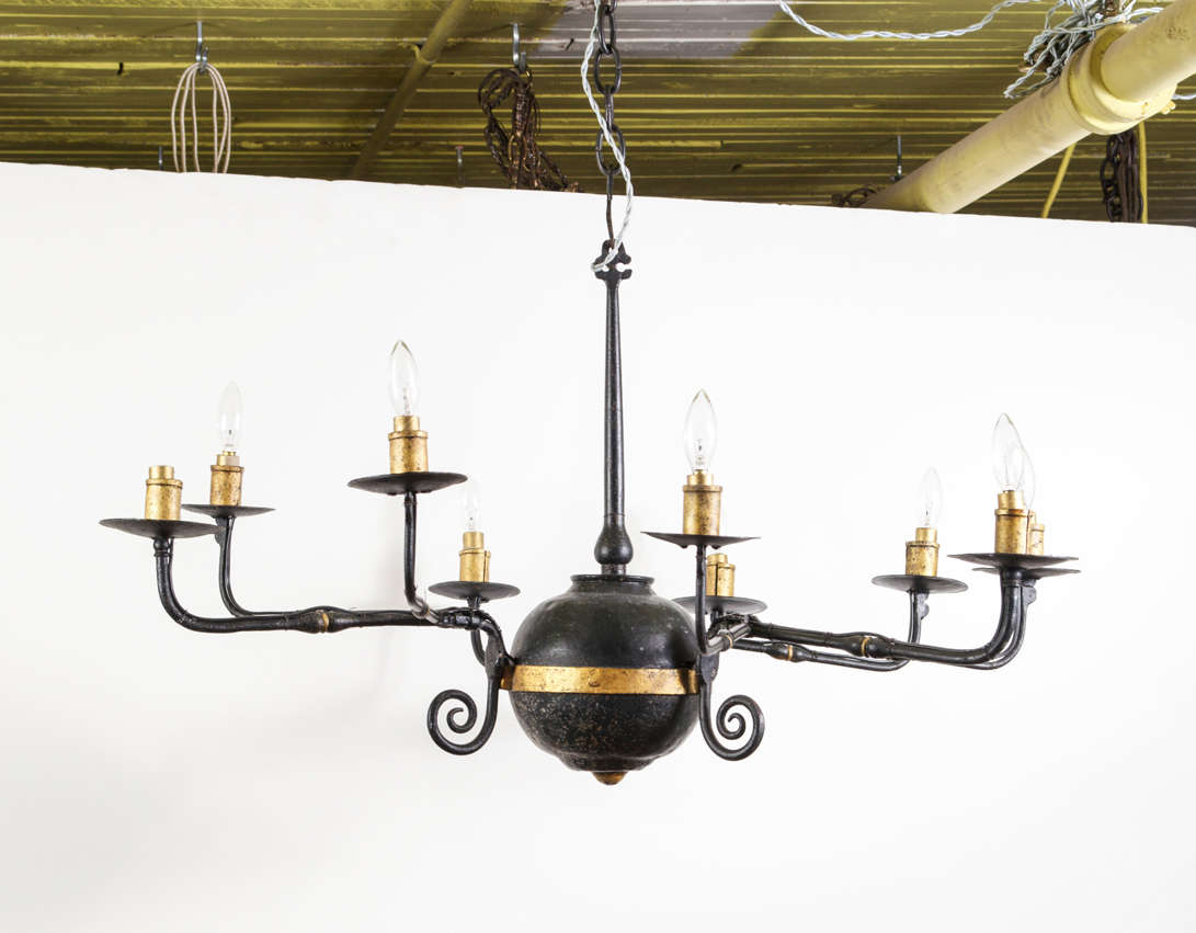 Newly rewired nine-light metal chandelier. Black and gold painted detail with.