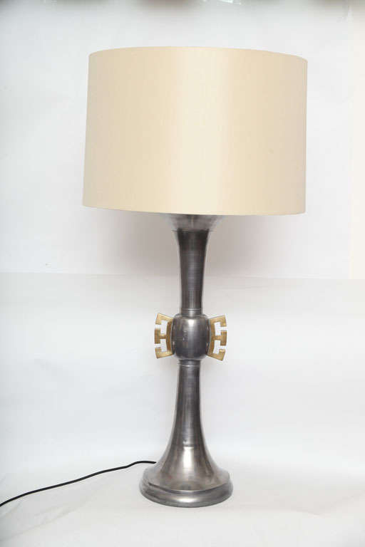 A pair of Asian modern pewter and brass table lamps 1940's
New sockets and rewired
Shades not included