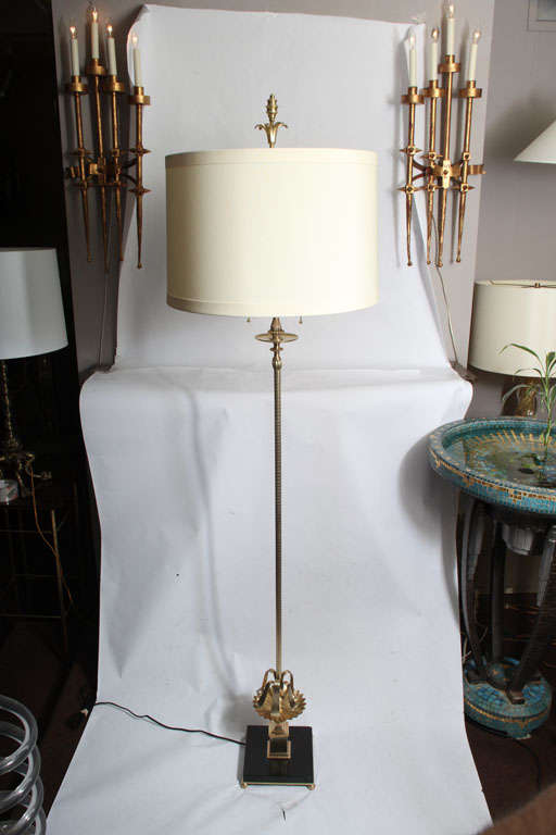 An elegant Art Deco polished brass and onyx floor lamp.
Shade not included