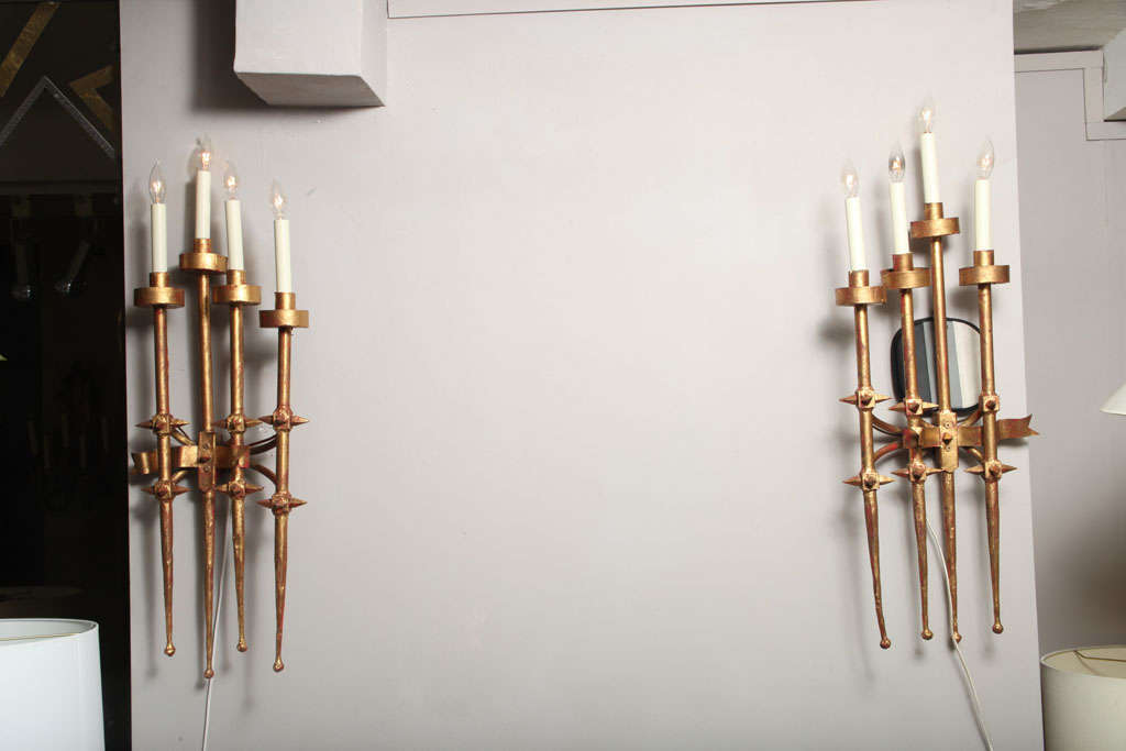 A pair of 1960s Brutalist gilt metal wall sconces.
