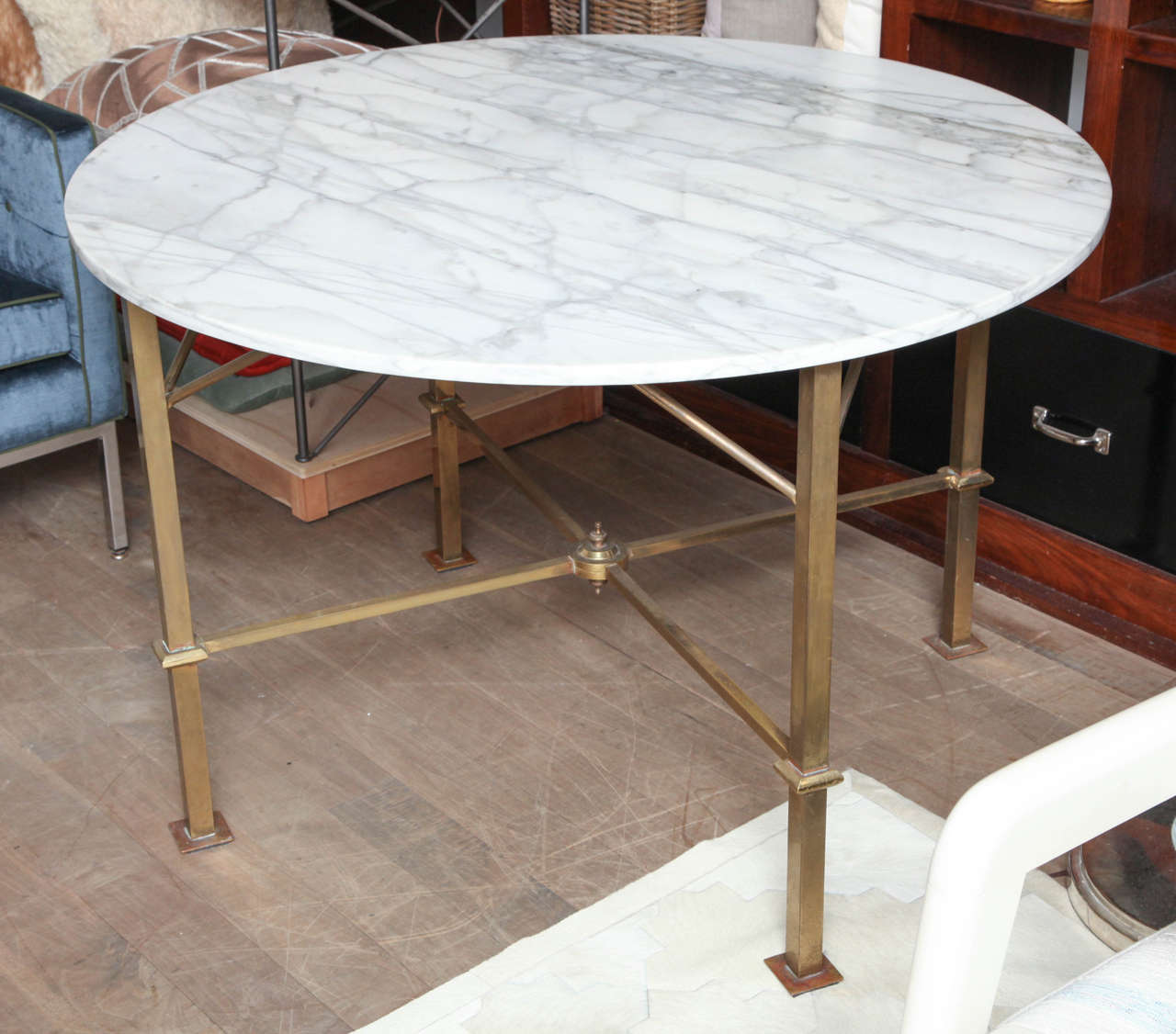 Italian brass base dining or center table with Carrara marble top in original condition in the manner of Gio Ponti.