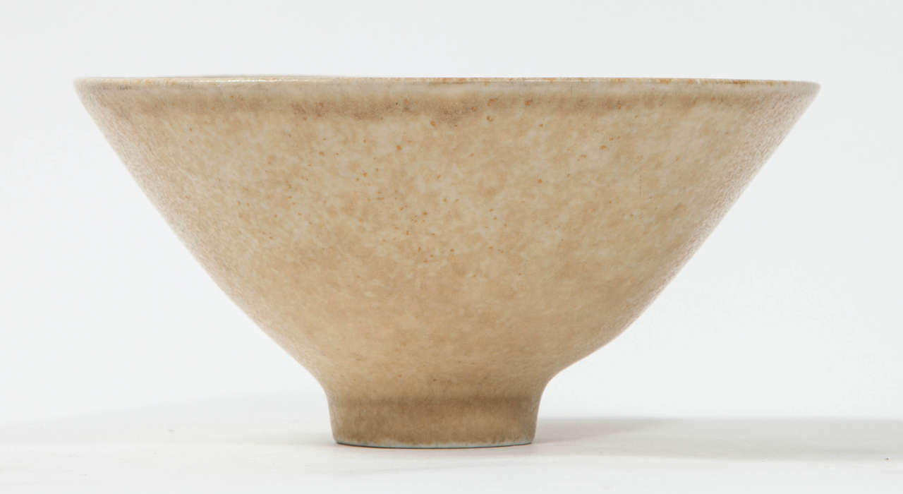 Carl-Harry Stålhane for Rörstrand wheel-thrown footed stoneware bowl with ochre hare’s-fur glaze. Incised signature and studio mark to underside: [R Sweden CHS SHX].

Carl-Harry Ingemar Stålhane was born in Mariestad, Sweden on December 15th,