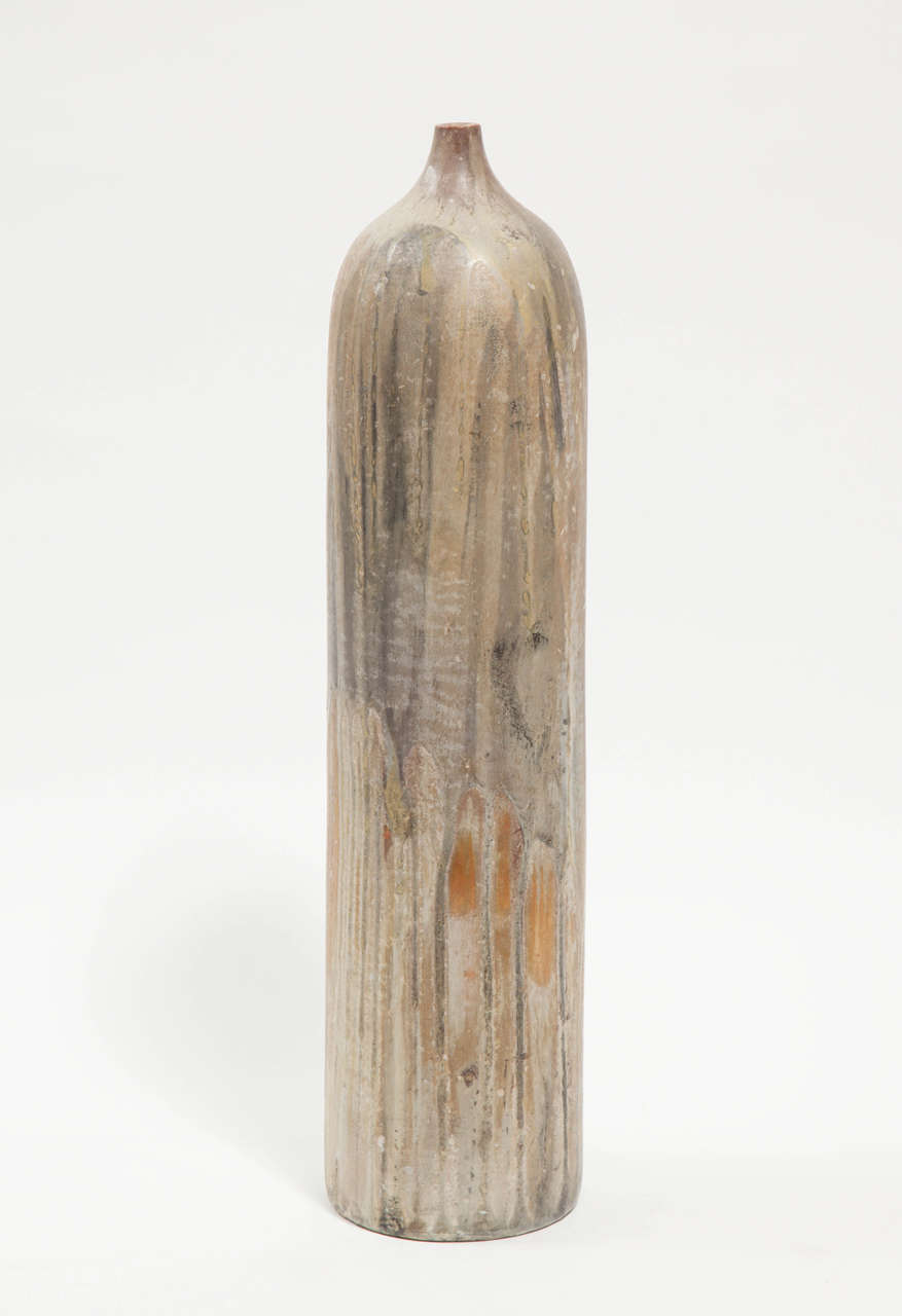 Marcello Fantoni cylindrical ceramic bottle vase is glazed stoneware made circa 1960s. This piece was acquired directly from the artist by the seller, who was a personal friend of Marcello Fantoni. Glazed signature to underside: