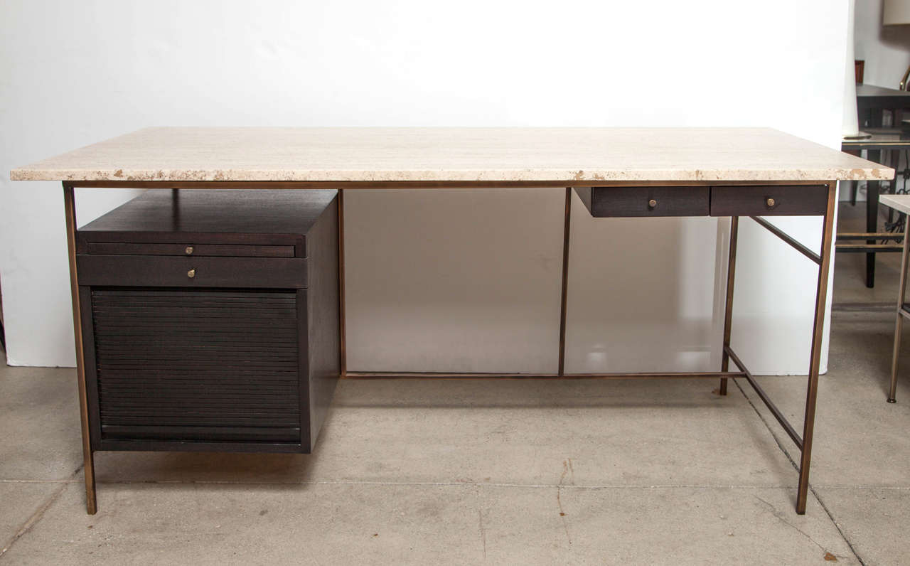 Rare Paul McCobb Desk for Directional with natural travertine top fully restored. Desk features pull-out drawers and a tambour door file drawer.