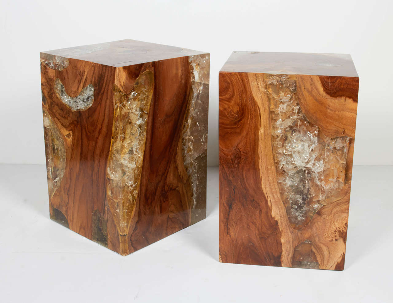 Pair of outstanding pedestal tables with cube form. Comprised of a combination of natural reclaimed teak wood with crystalized cracked resin. Versatile shape and size allow for dual purpose tables and seating. Highly polished wood and resin finish
