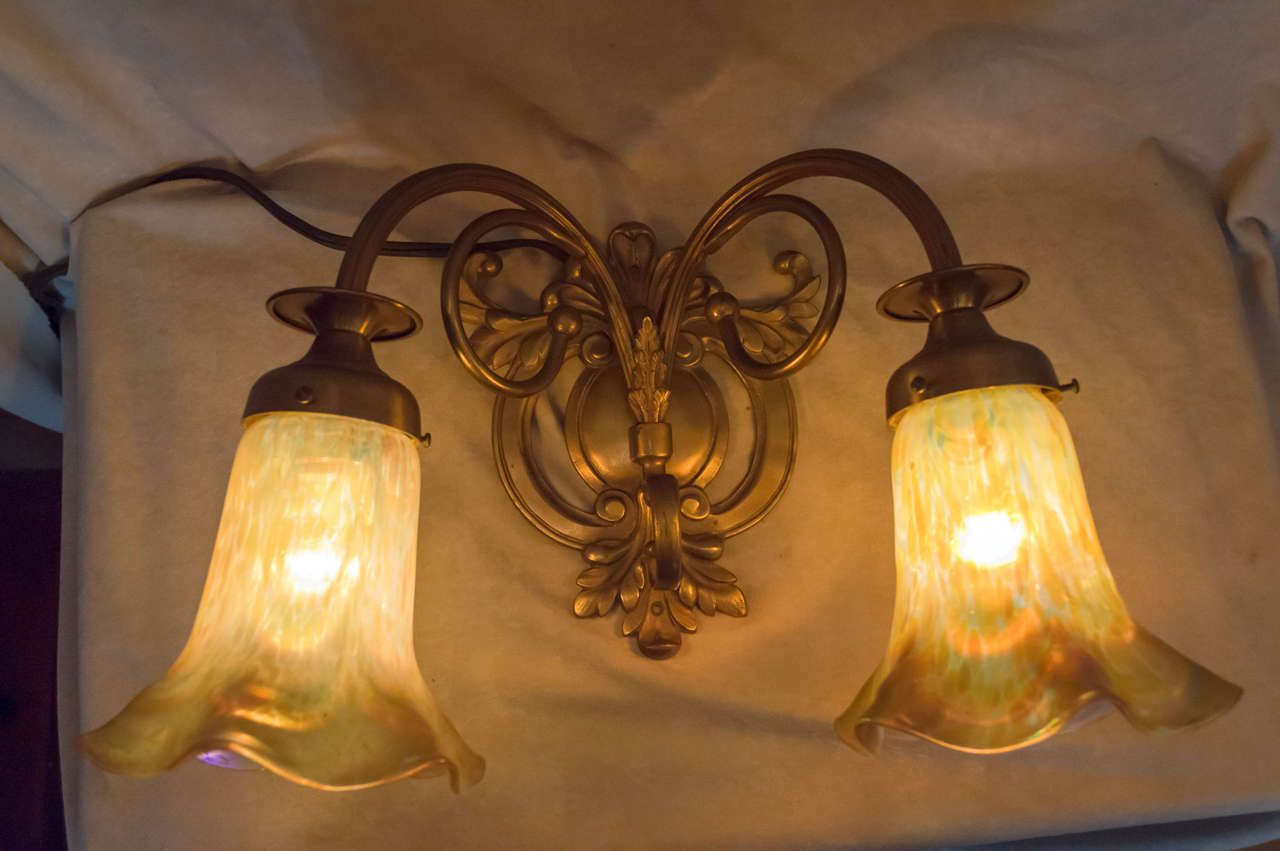 These graceful sconces can bring any room to life. Nice clean metal work on these American sconces, and enhanced with Austrian handblown 