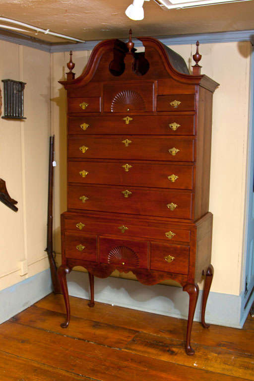 A Connecticut Cherry Bonnet top high chest that is well proportioned and of very desirable diminiutive size. This chest was removed from a CT home where it had been in their beloved collection for the last 60+ years. It has a high sweeping full