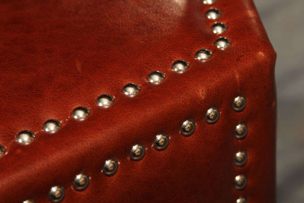 Leather leather and nailhead upholstered ottoman/coffee table