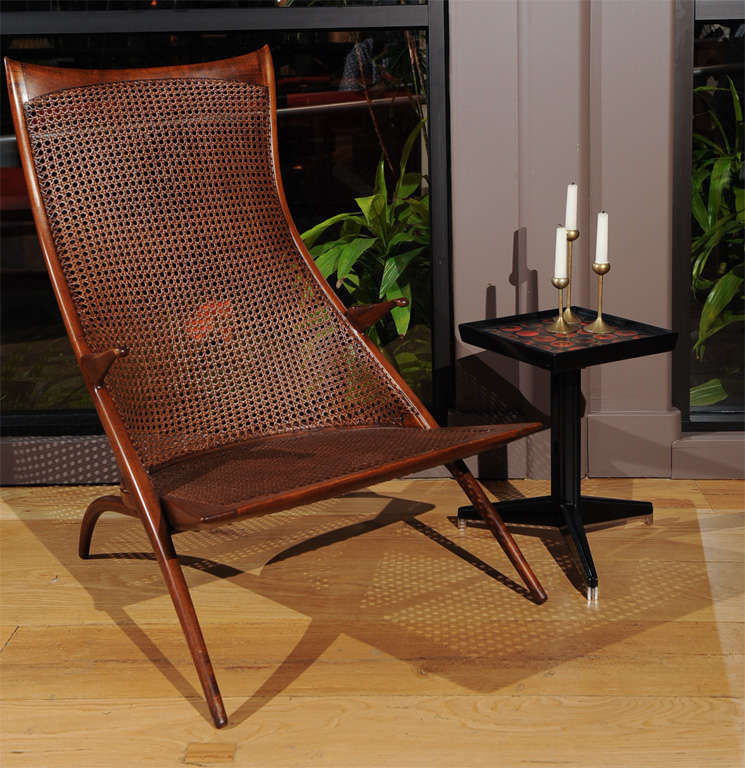 A walnut and cane high back gazelle series lounge chair designed by Dan Johnson and produced in Italy.