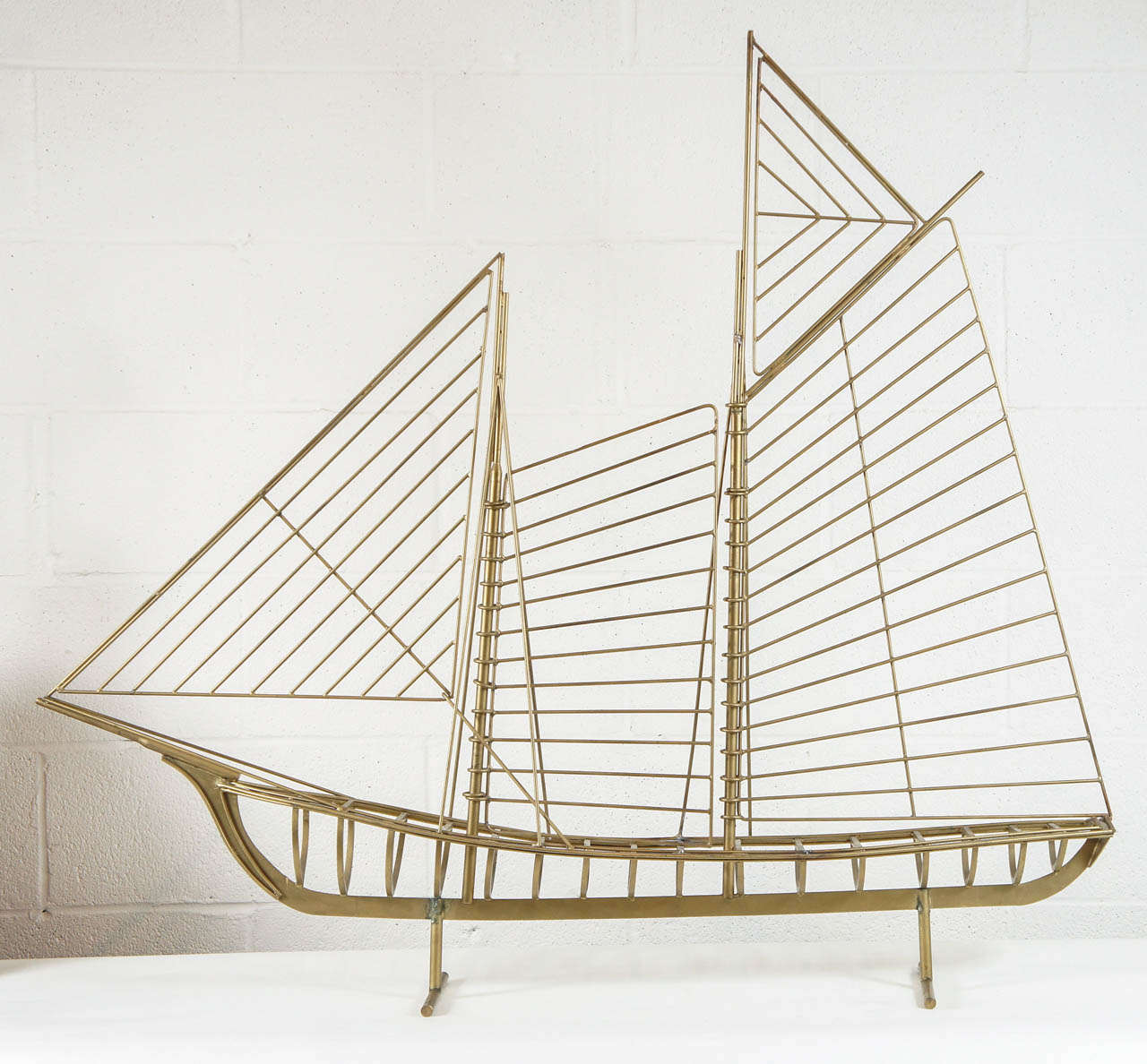 Here is a linear sculpture of a sailboat by Curtis Jere. Great form.
