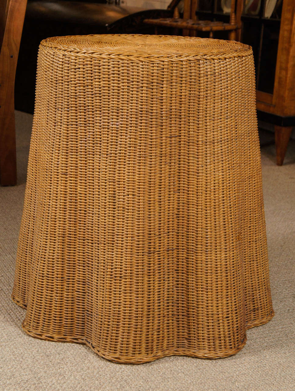 Here is a charming draped wicker side table.