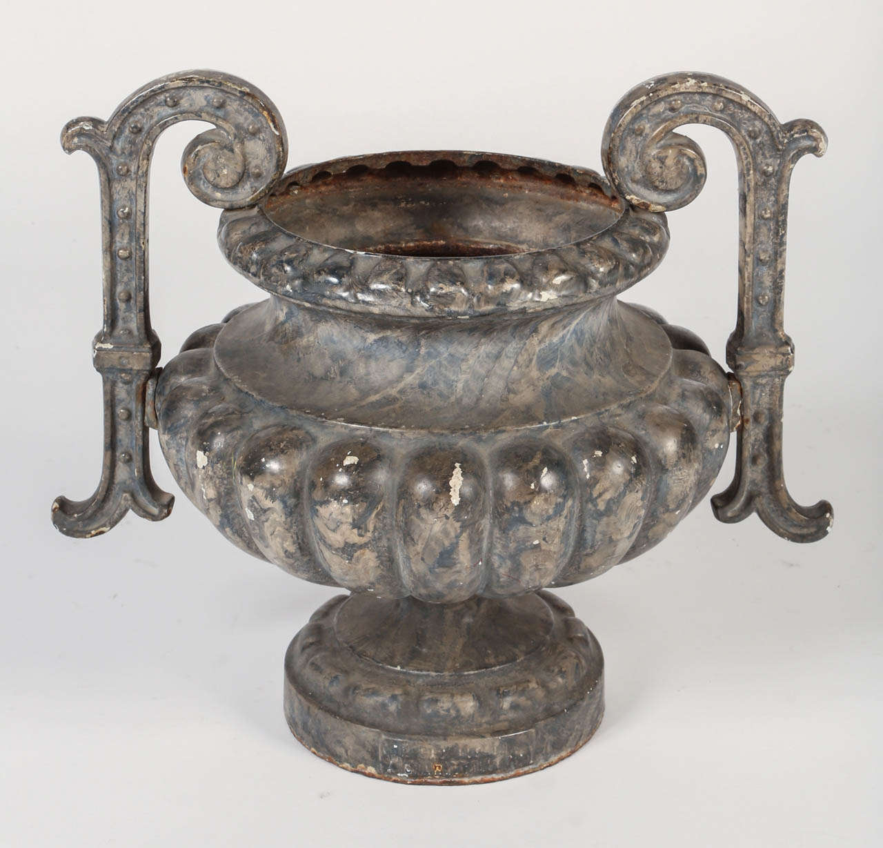 Gorgeous antique lobed and double handled French iron urn, circa 1880.
Stamped Alfred CORNEAU Foundry in Charleville.
This piece would be wonderful inside as a vase or placed outside to dress up a patio or balcony.