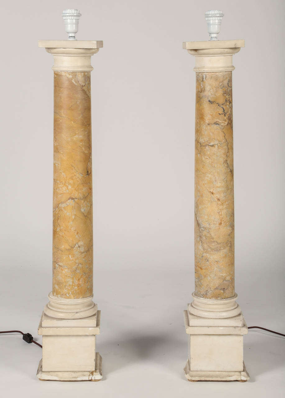 This overscale pair of 19th century giallo and white marble columns have been converted into a terrific pair of table lamps.