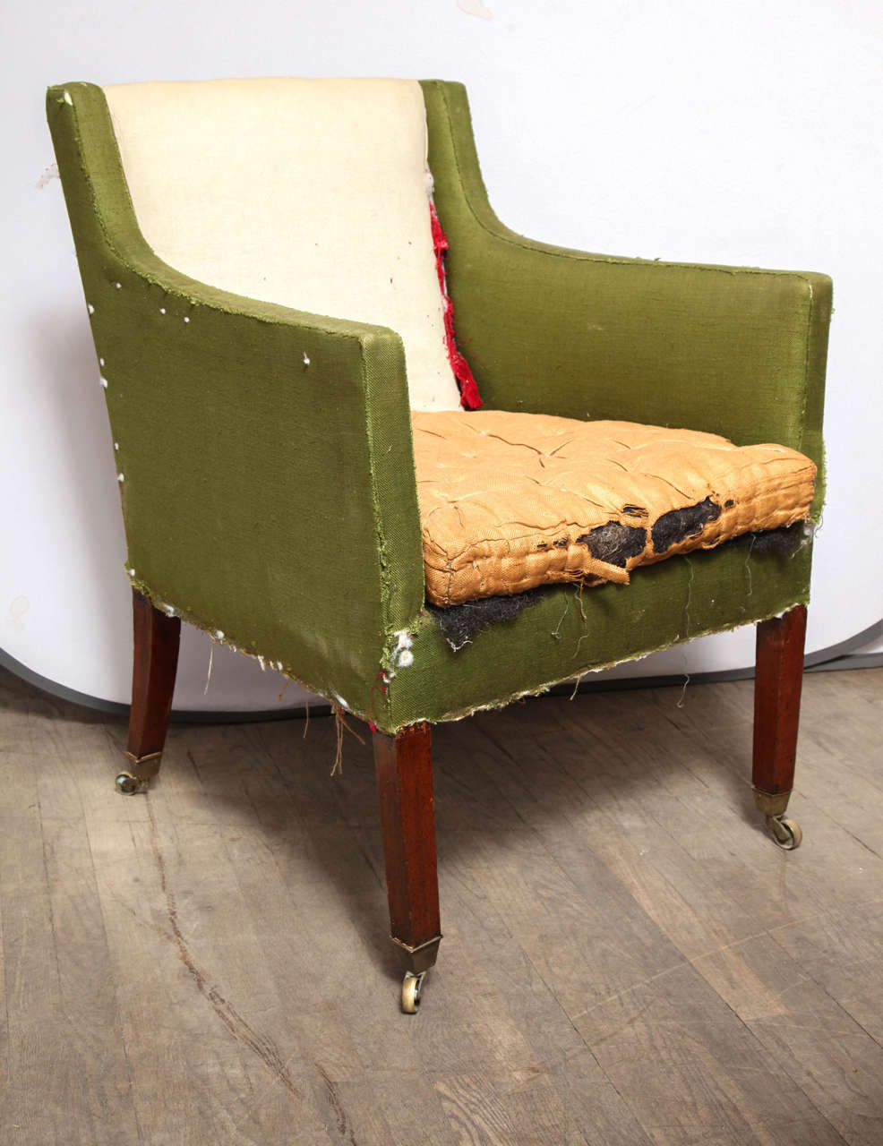 A rare and unique 19th C. Library chair from C. 1810-1820. This Chair stands in its original condition in 100% functional condition. This piece requires upholstery or can remain as is in original condition. 

This chair was sourced from an