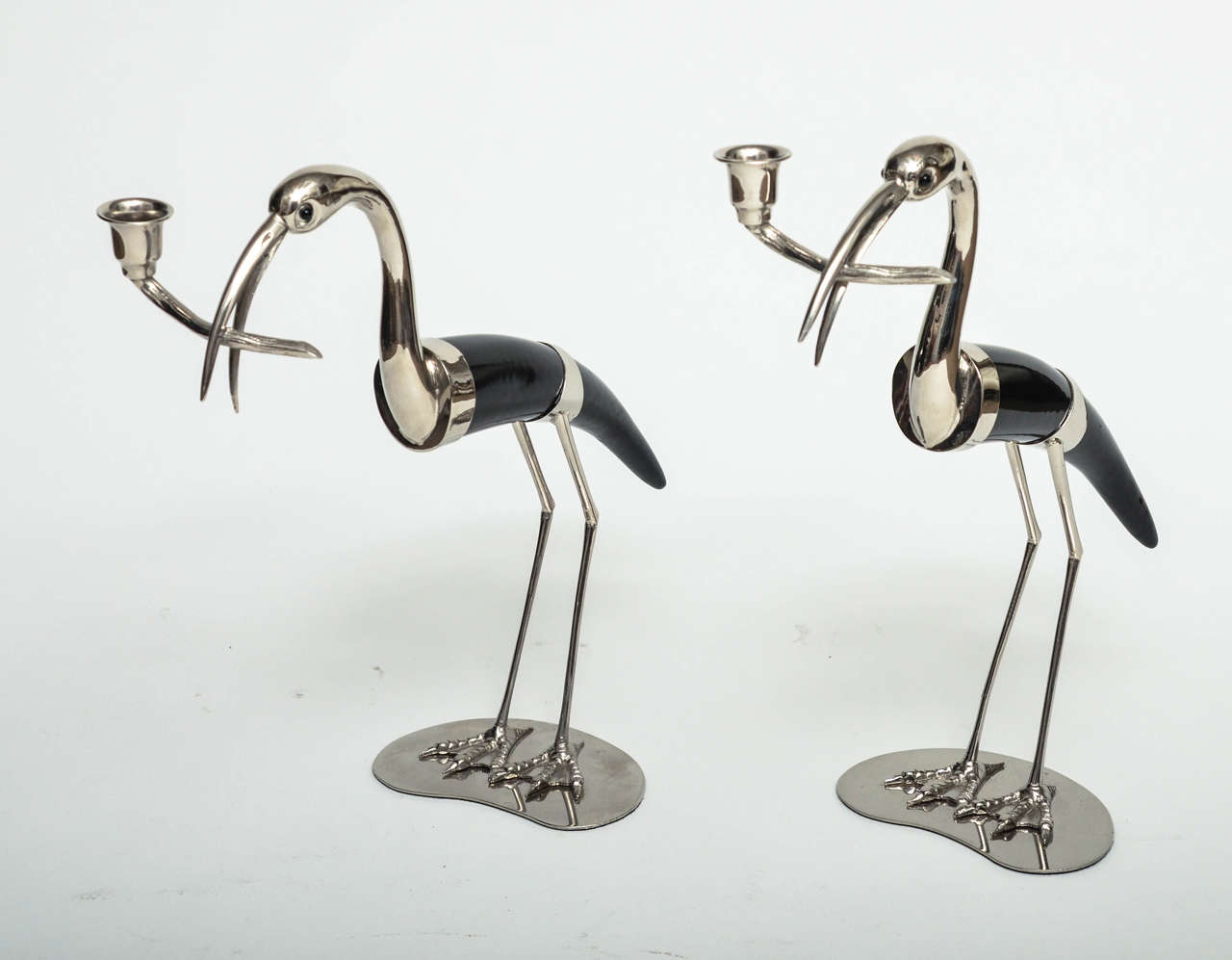 Pair of bird form candelabra composed of horn and nickel.