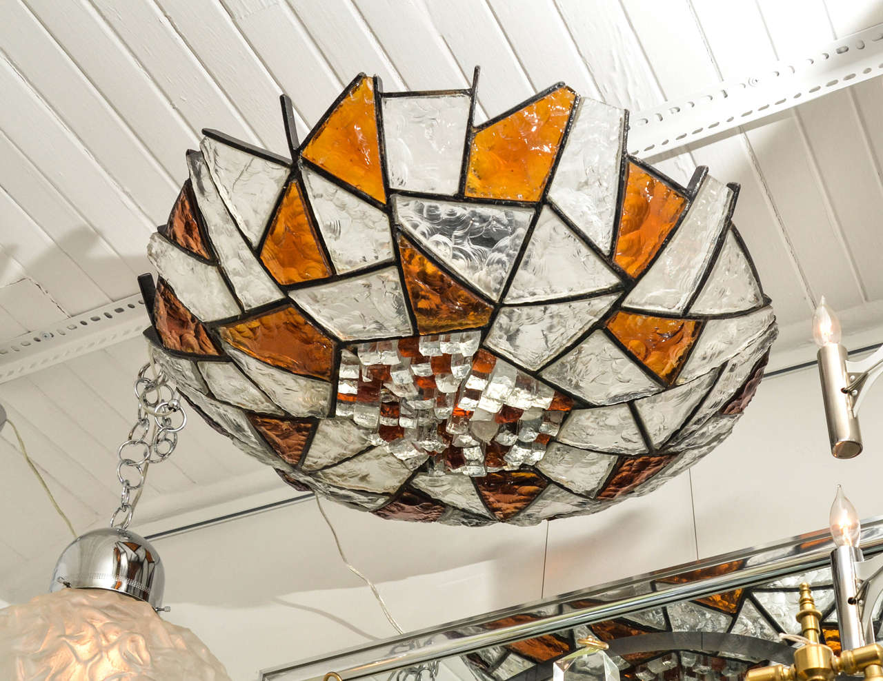 Mosaic style flush mount ceiling fixture composed of carved clear and amber glass fragments, in the style of Poliarte