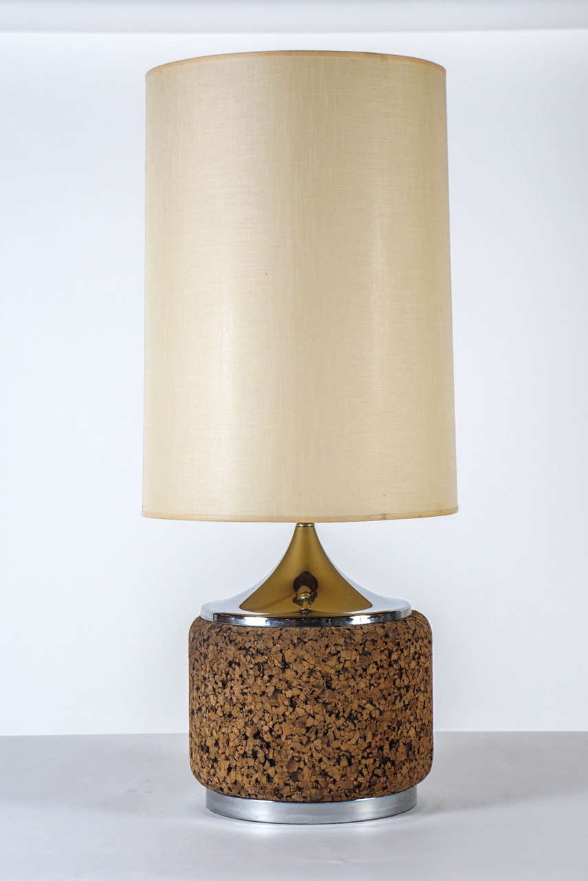 Oversized bottle form in the chocolate brown large-grained cork widely-used in the period. Polished chrome base and neck in excellent condition, no pitting or marks. Very slight oxidation in a few areas, but only noticeable upon close inspection: