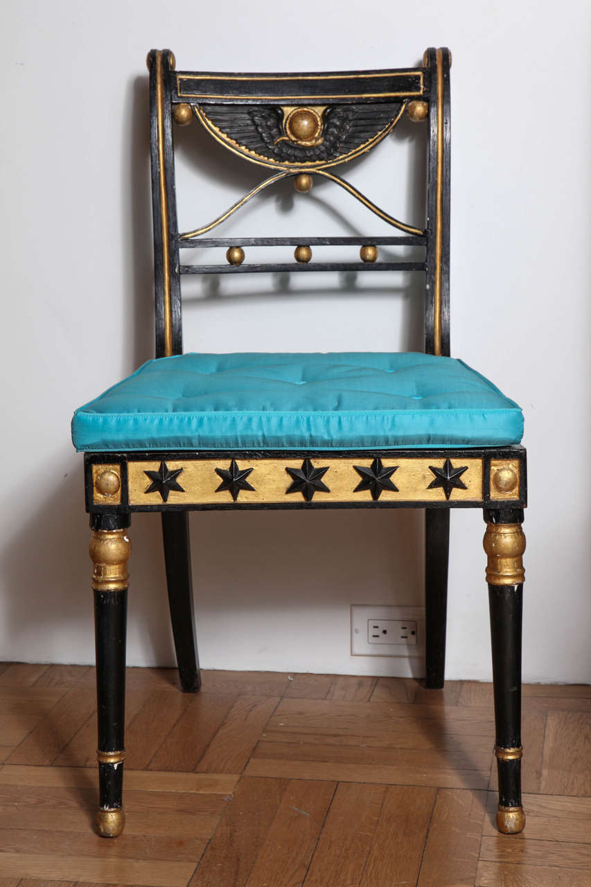 A Set of Six 19th Century Ebonized and Parcel Gilt Egyptian Revival Regency Chairs with Caned Seats,
England Early 19th Century