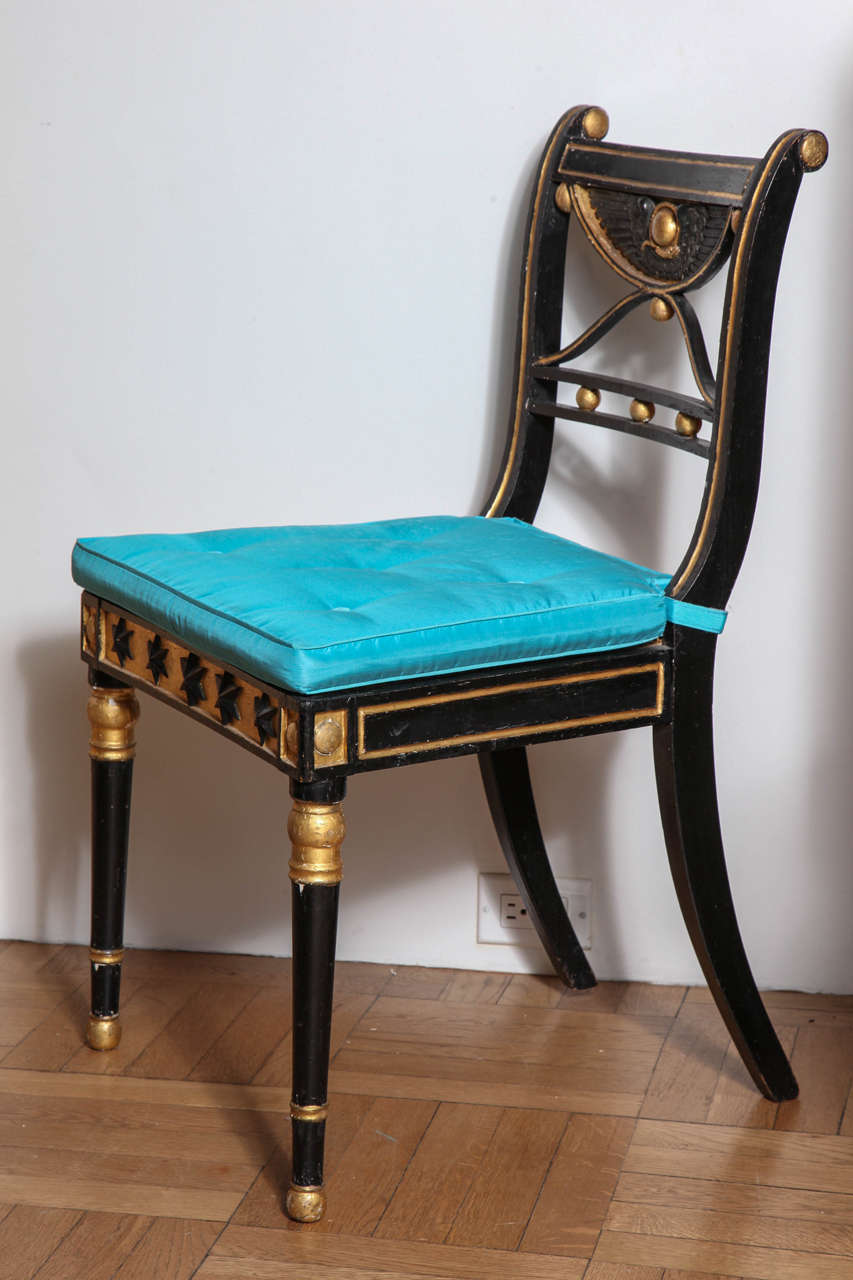 British Set of 19th Century Ebonized and Parcel Gilt Egyptian Revival Regency Chairs For Sale