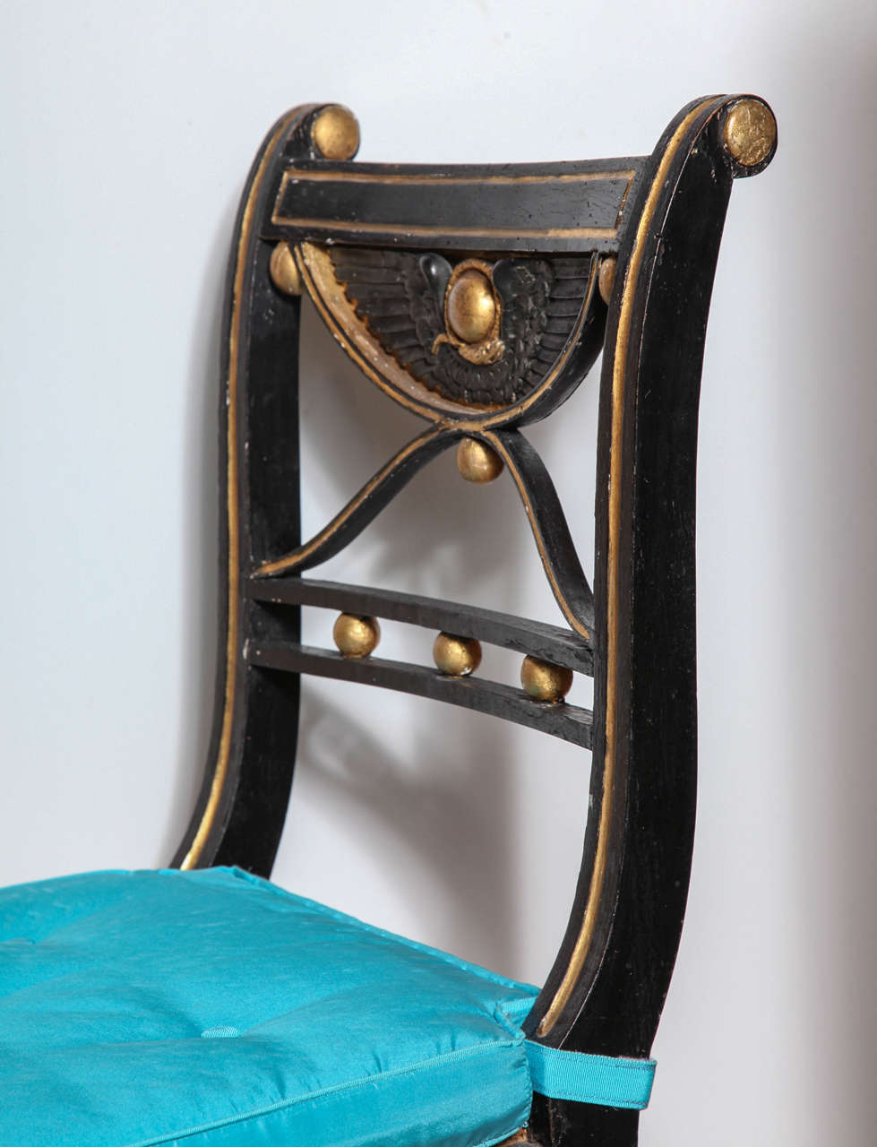 Wood Set of 19th Century Ebonized and Parcel Gilt Egyptian Revival Regency Chairs For Sale