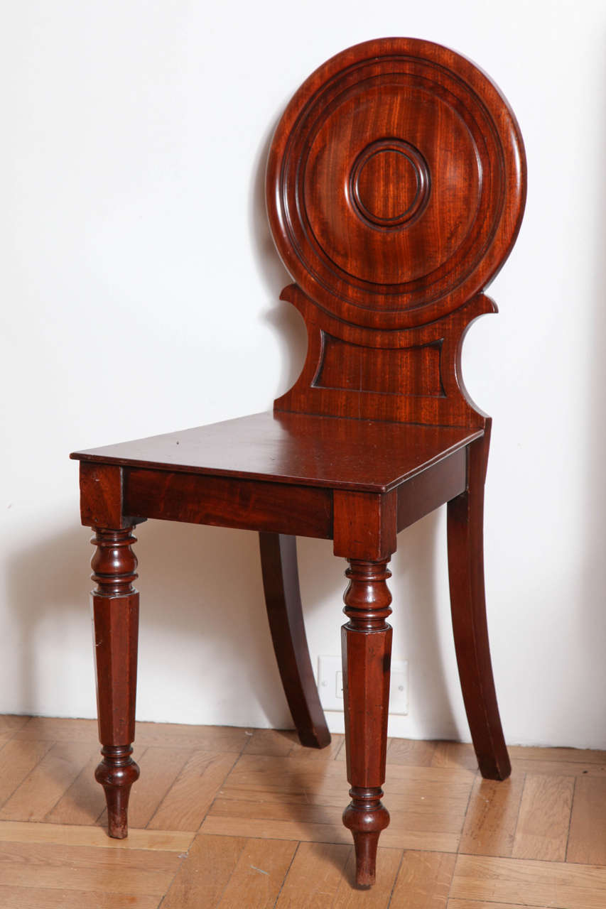 A Pair of Carved Mahogany Hall Chairs, England Early 19th Century