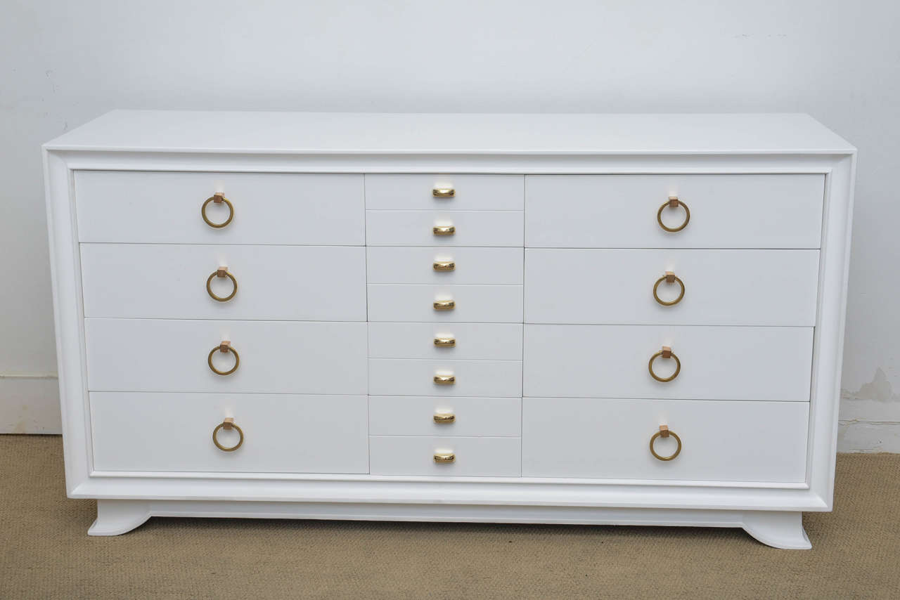 Amazing Hollywood glamorous 1940s dresser. Piece has beautiful solid brass hardware. Finish is satin white. Piece houses eight large drawers and four smaller center drawers, perfect for smaller garments. Please see all photos for more detail. Please
