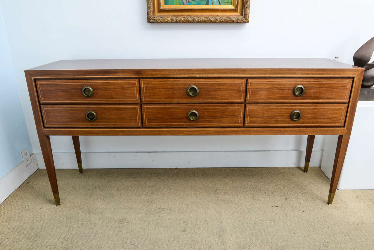 Designed in the 1930s by Renown Designer Paolo Buffa, however piece was produced in the 1940s. Piece in in excellent condition, beautiful inlaid marquetry and hardware is all original brass. Legs still retain the original feet also in brass. Drawers