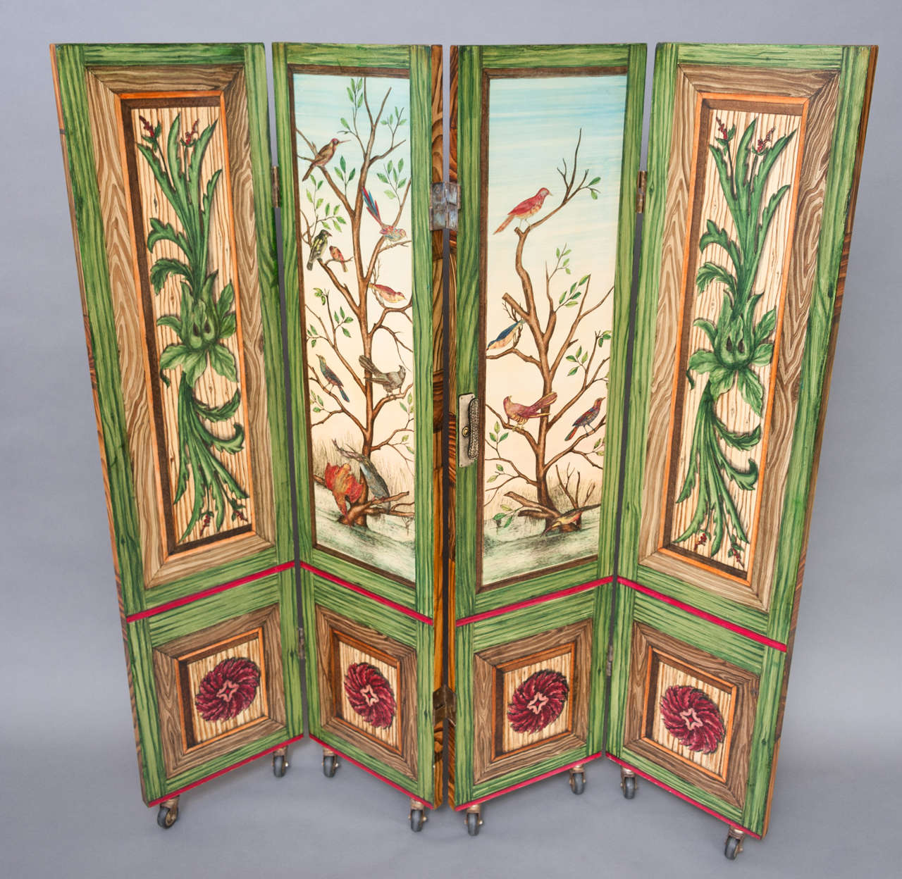 A medium size chamber screen in the manner of Fornasetti, decorated with lithographical print of panels with birds on one side and trompe l'huile of wood with paintings on the other.
Italy circa 1960