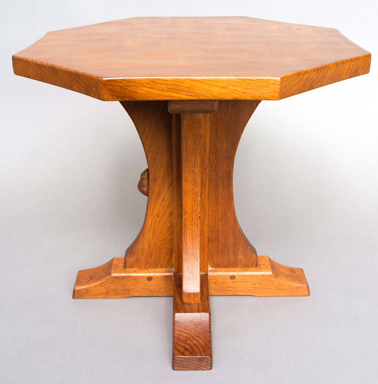 An Oak octagonal side table by Robert "Mouseman" Thompson.
On cross legs.
Carved Mouse signature.
England circa 1965