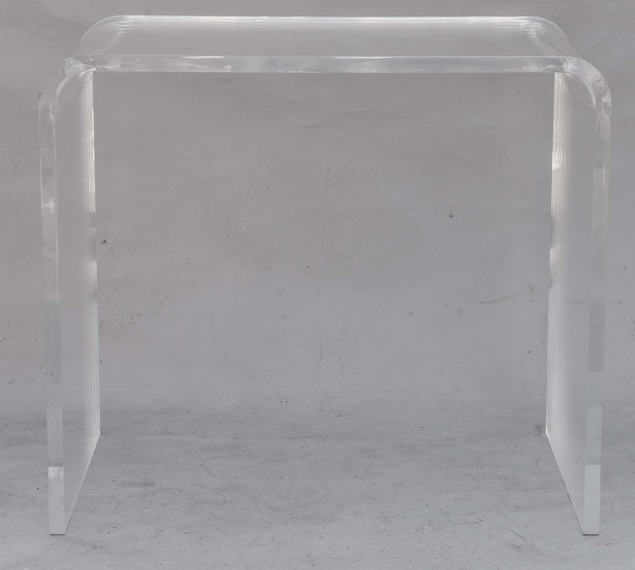 Waterfall form vanity table, of Lucite.