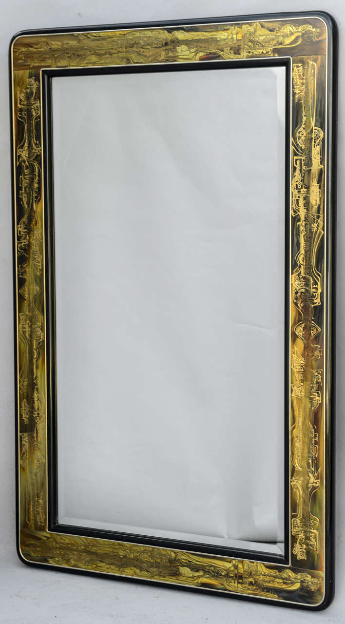 Pair of mirrors, each rectangular frame decorated with etched bronze on lacquer background, surrounding bevelled plate.