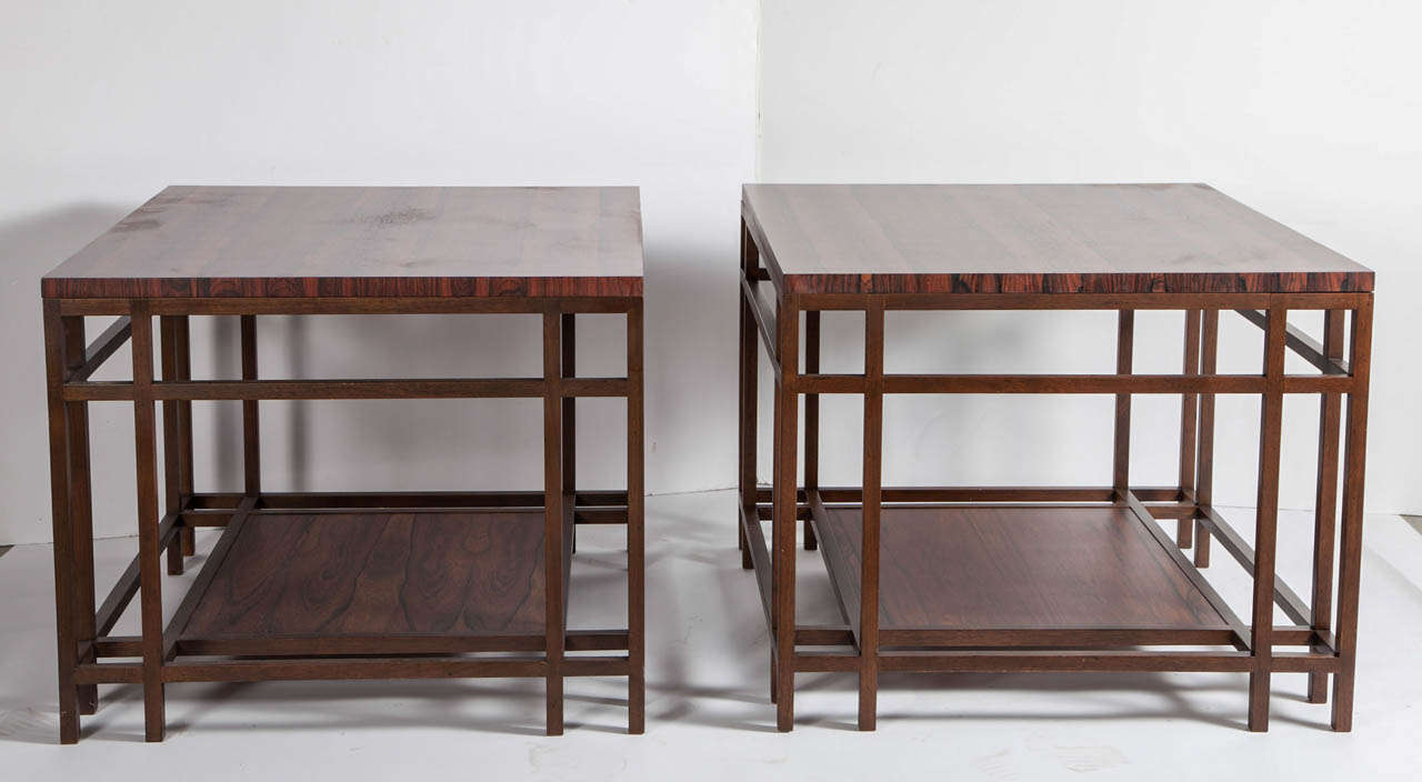 Two-tier tables in dark walnut centered by boldly figured rosewood surfaces. A very unusual early 1960s design attributed to Winsor White for Baker Furniture.
Baker Furniture brass labels to underside of each. Newly refinished to original
