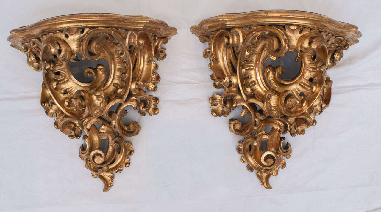 French, circa 1725 late Baroque hand carved and gilded wood contoured corbels with elaborate supports