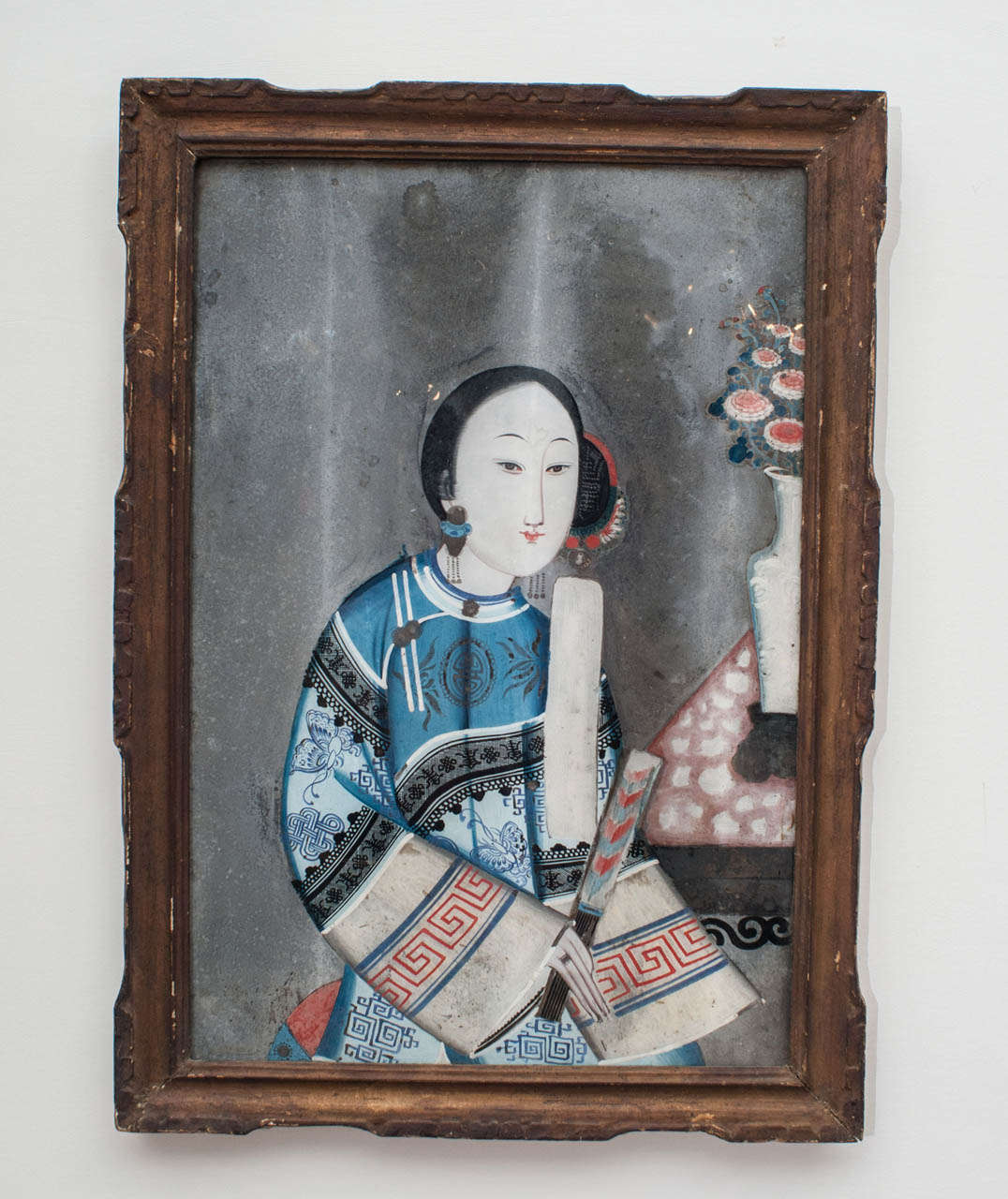 A Nineteenth Century Chinese portrait of a woman, reverse painted on glass.