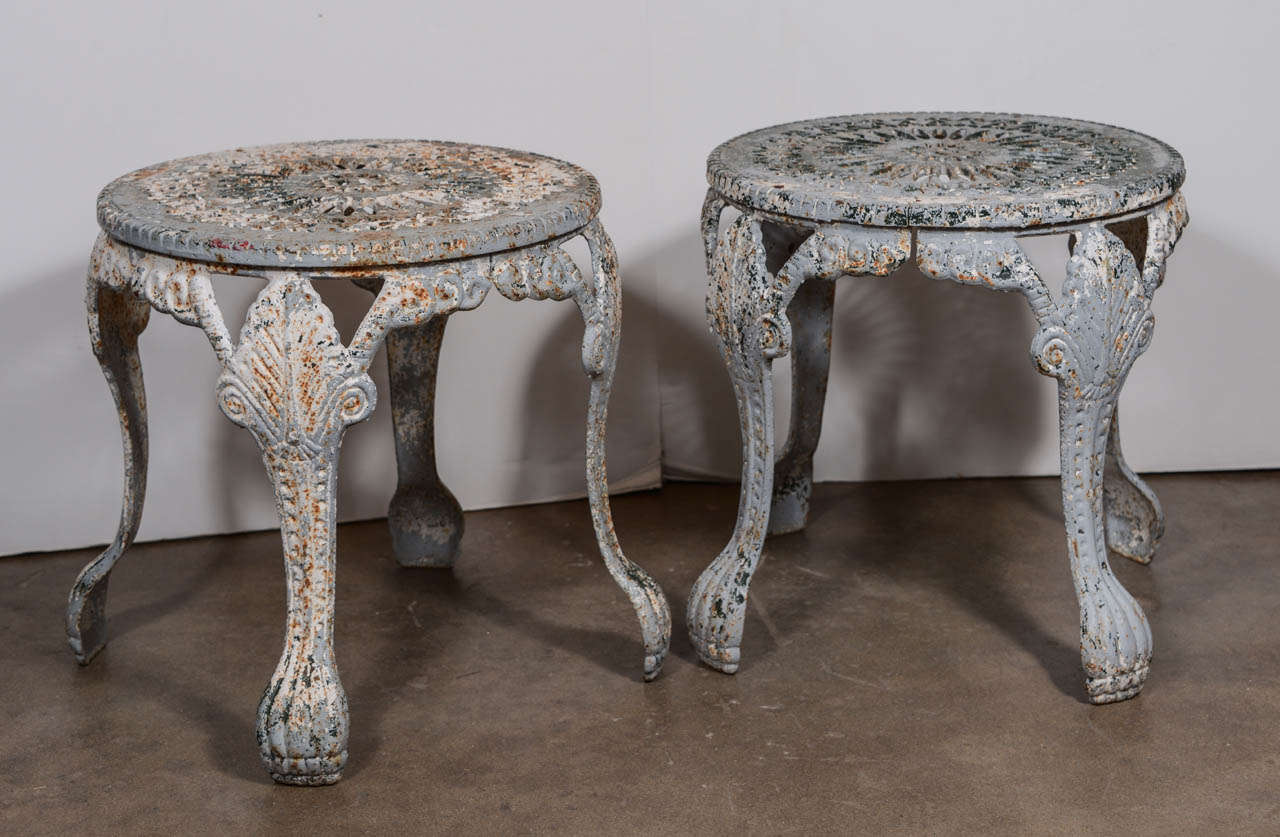 Beautiful patinated English garden stools. Sold in pairs. 3 pair available. Priced per pair. Can be used as stools or small tables.
