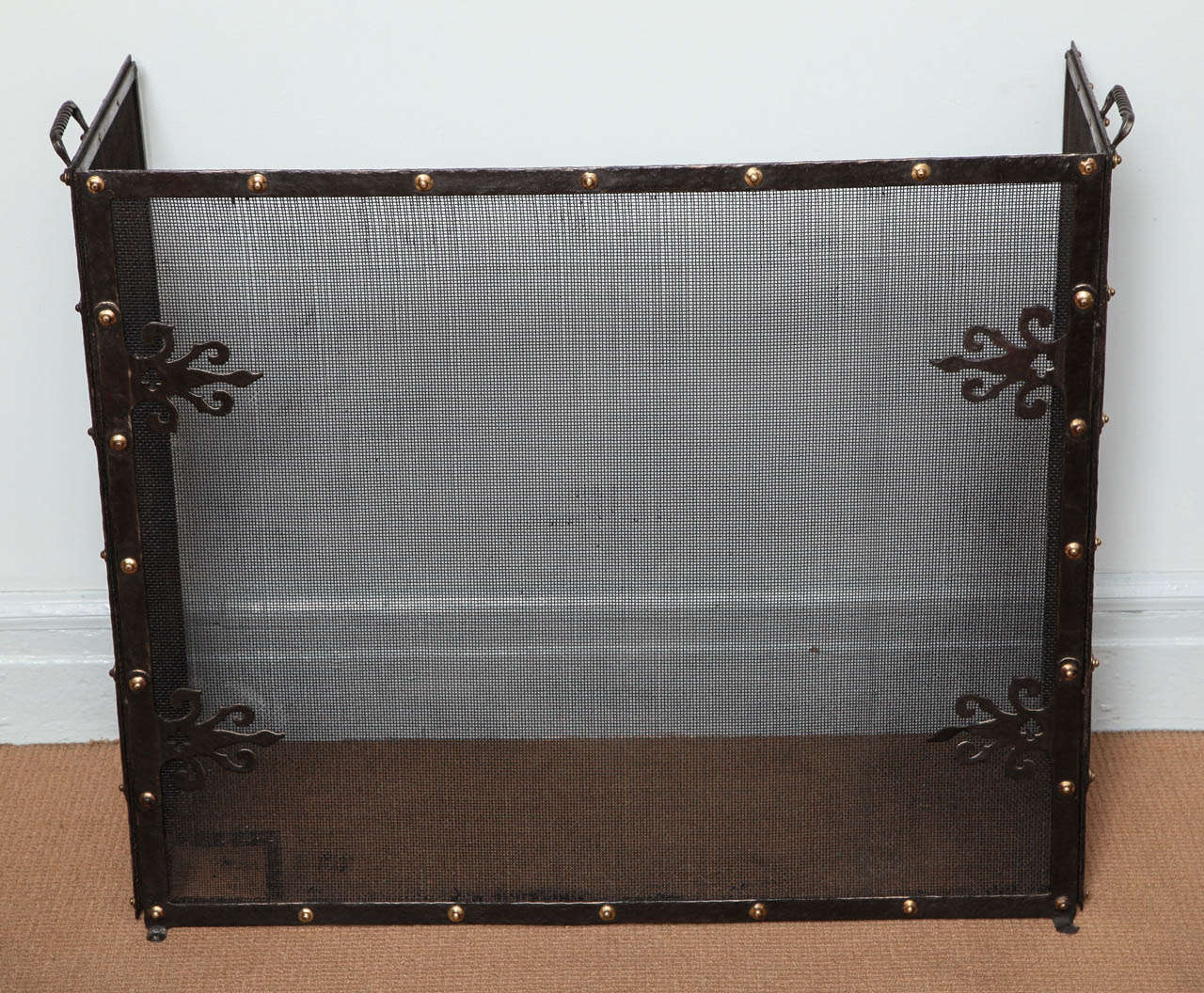 Fine Arts and Crafts wrought iron and copper riveted folding fire screen, English circa 1900, of good design and fine workmanship.  One patched area in lower corner of screen, otherwise perfect.