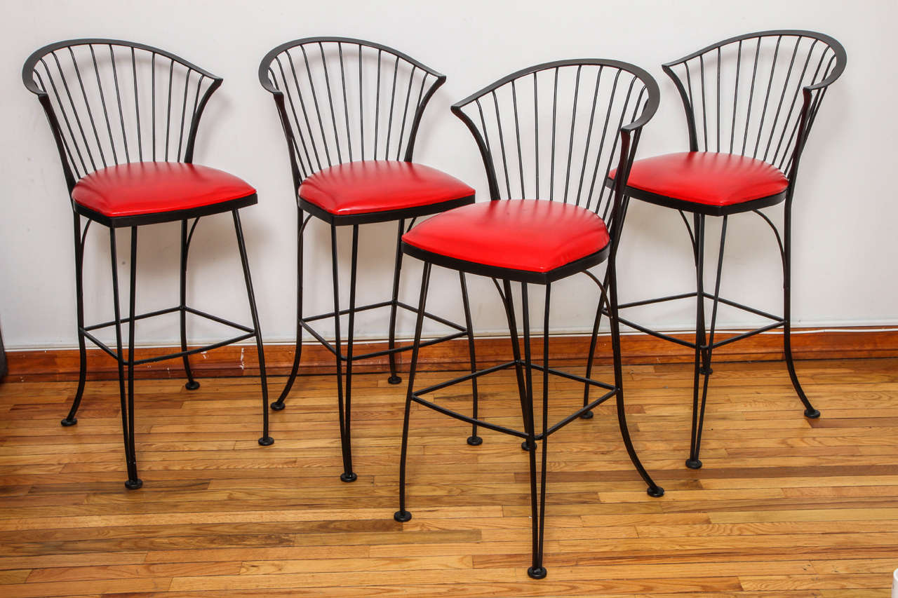 Store closing-- last day is 7/31. Offers welcome! Wrought iron bar stools with original red vinyl upholstery. Signed with manufacturer's sticker to underside of frame.