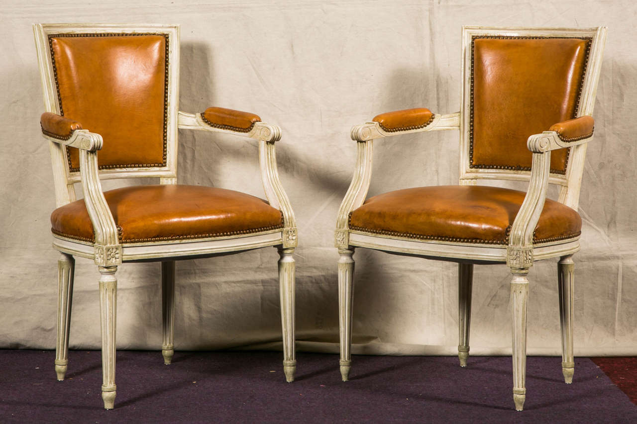 Pair of Louis 16 Style Armchairs , 
Painted Wood , recovered with a nice gold Leather,
France 20 th