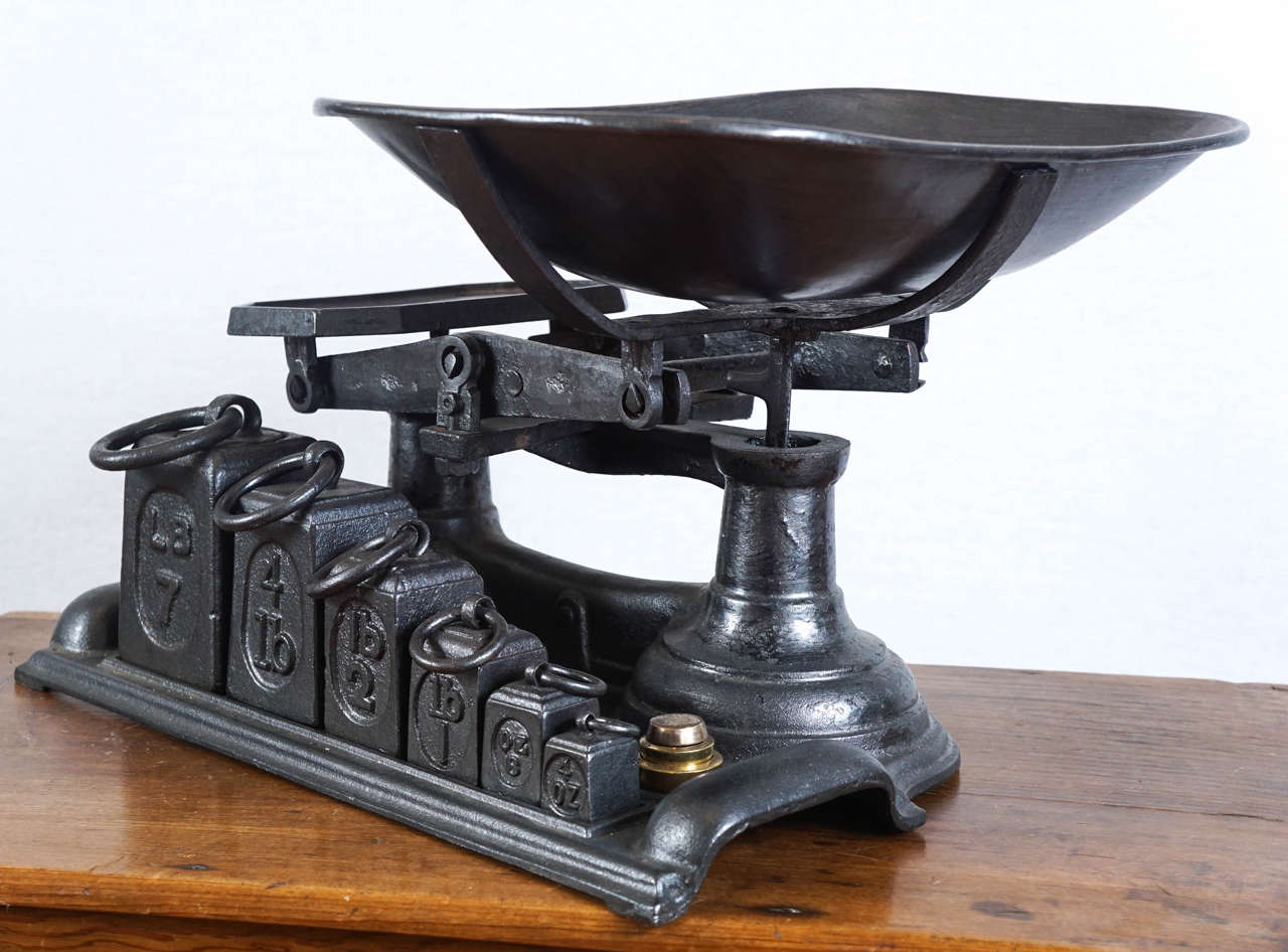 This is part of a very large collection of English, French and American scales at Painted Porch. This one is quite unique in that it has its entire set of original weights.  Its a stunning grocery scale and we love scales as accessory items , used
