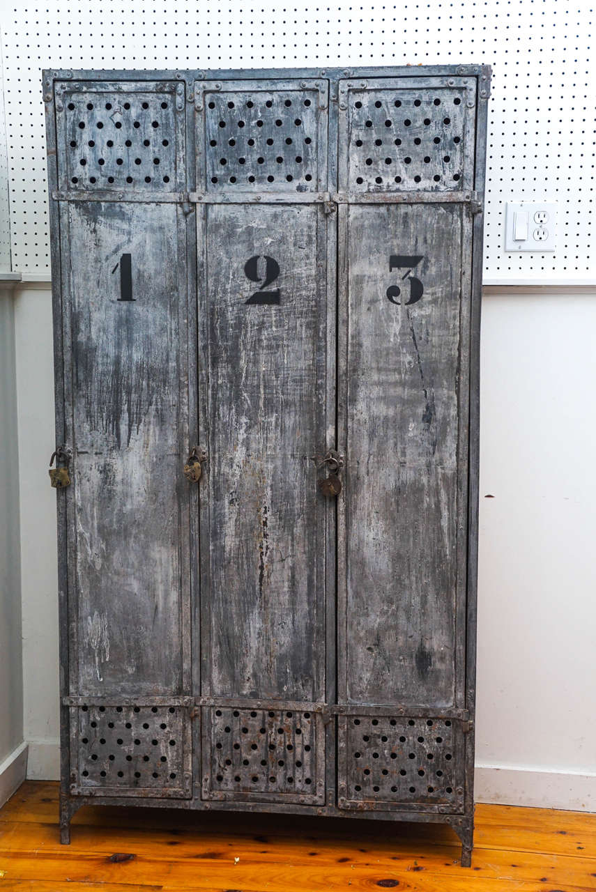 This school locker came from a small school in the south of France. The worn grey color and worn black numbers are perfect. Notice the air vents on the top and bottom of each locker. Each locker also comes with its original locks. This would be