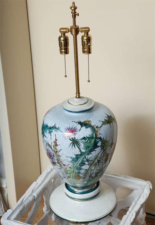 Mid-20th Century A pair of polychromed decorated porcelain lamps