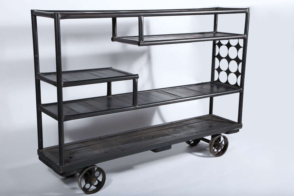 Cast Iron base and casters. Welded-metal pipe frame with metal shelves.

*Not available for sale or to ship in the state of California.