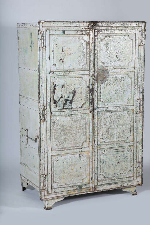 Metal two-door Industrial cabinet in distressed white patina. Dual locking system, three shelves and three handles on the outside.

*Not available for sale or to ship in the state of California.