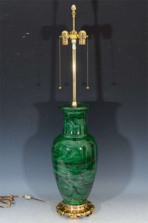 A pair of vintage Marbro table lamps with brass bases and necks. The ceramic bodies are in green and black with a 