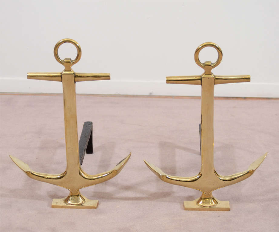 A pair of vintage nautical themed brass and iron anchor form andirons by Puritan.