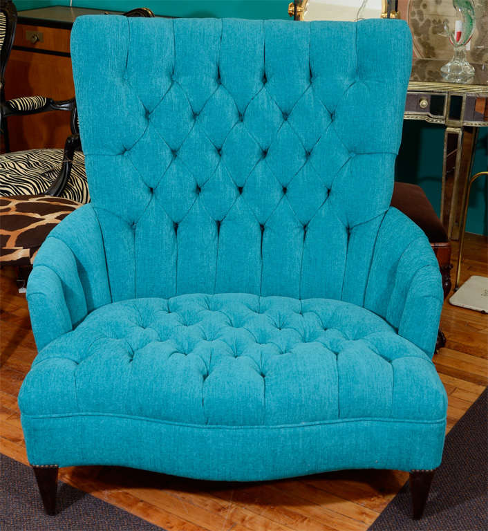 A vintage, extra wide chair (referred to as a 