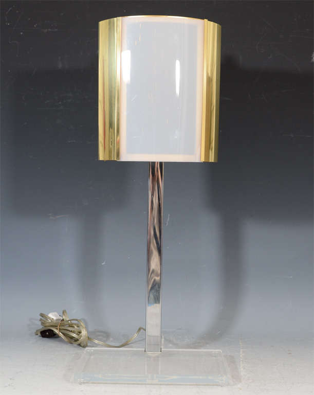 A pair of table lamps with Lucite bases, chrome bodies and a brass shade with white Acrylic insets by Charles Hollis Jones.